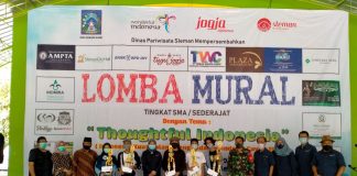 Berikan Semangat Menghentikan Pandemi Covid-19 Melalui Lukisan Mural